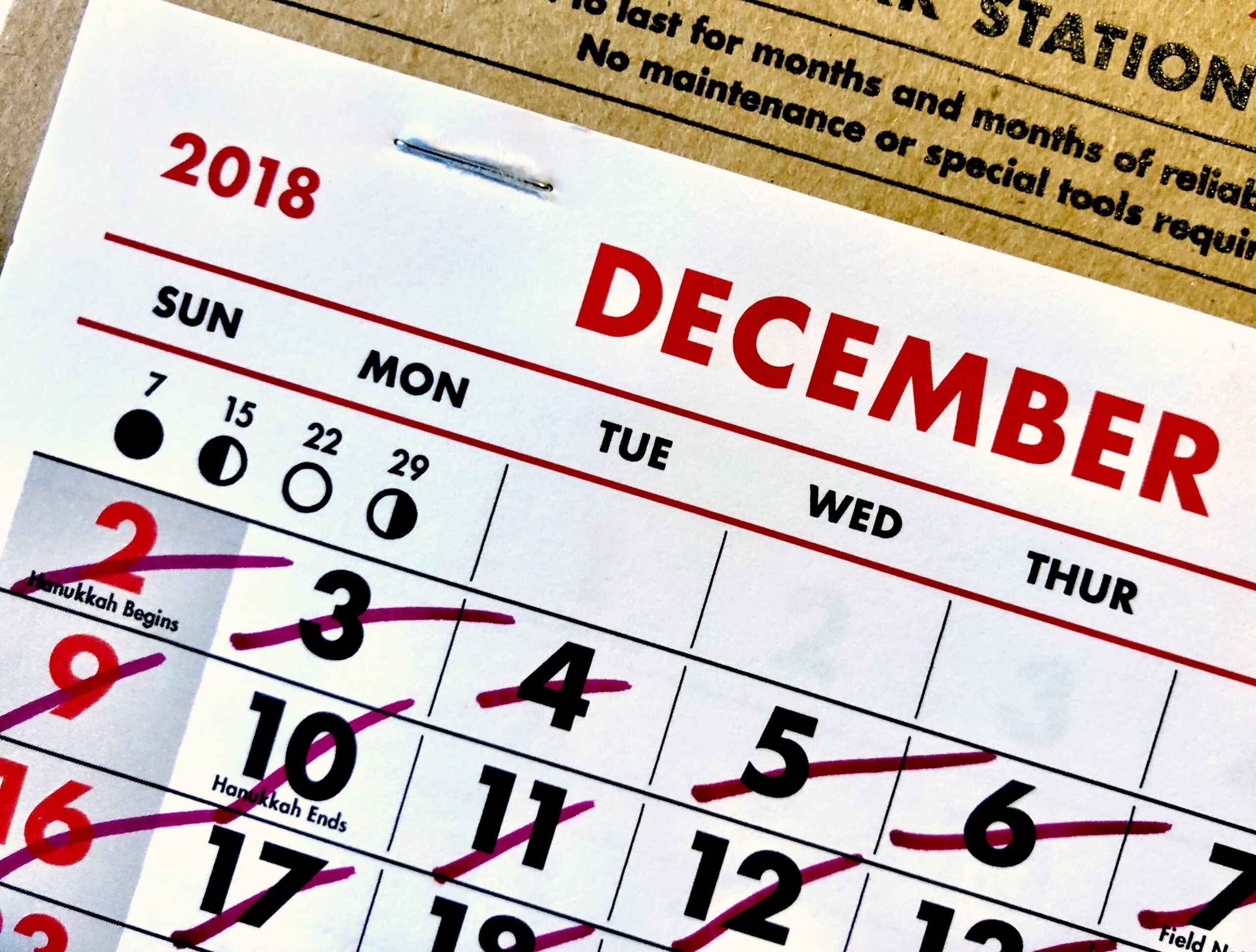 A photo of a desk calendar highlighting key dates for submitting paperwork.