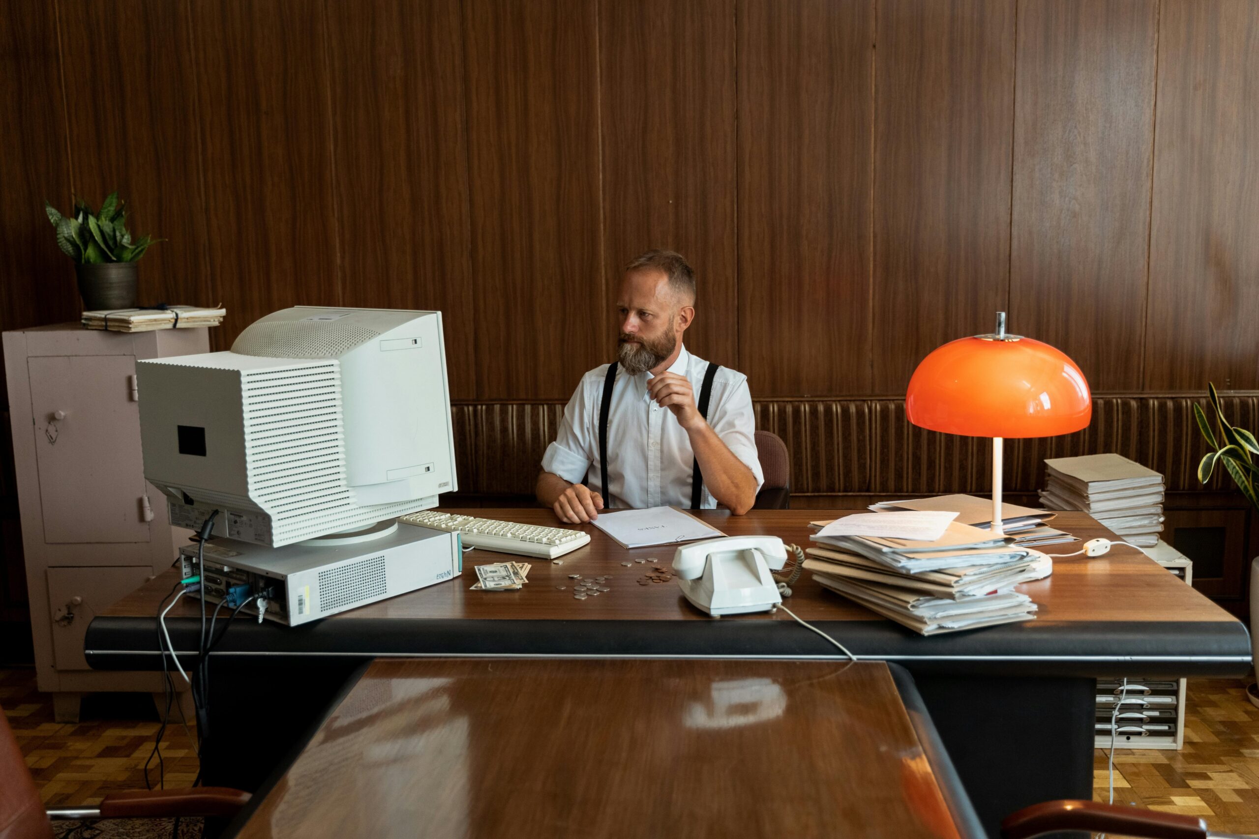 Stack of Insurance Documents on Wooden Desk