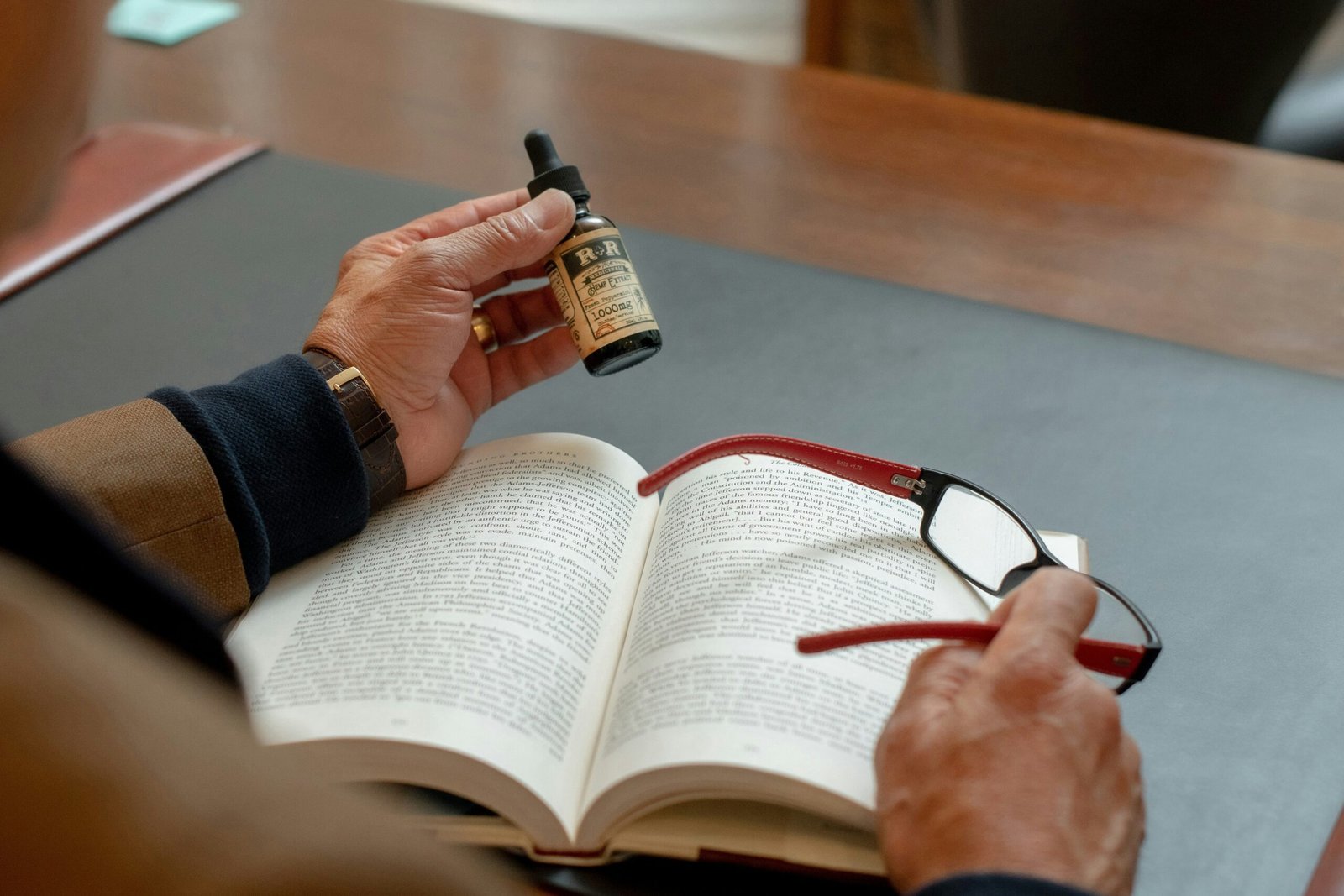 Man reading through complex insurance document under a magnifying glass