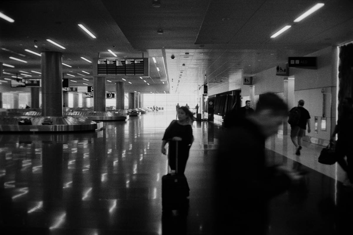 People walking through a modern airport terminal
