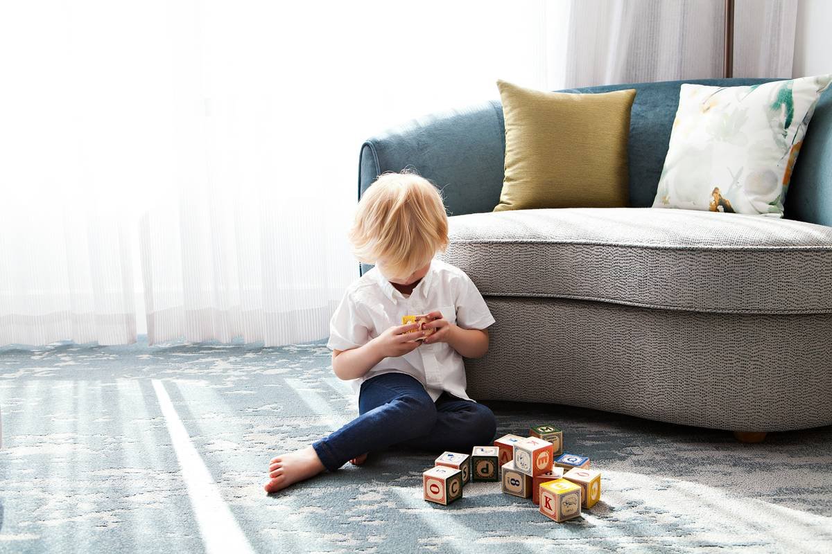 This image was taken for my client, Nannybird—an LA-based nanny service. I shot at a chic hotel in Hollywood and lucked out with the all-white walls that served as a fabulous bounce card for the floor to ceiling windows that had gorgeous afternoon light streaming in. This photo was taken during the one millisecond that the child wasn’t bouncing all around and with him being backlit, it’s one of my favorite images from the shoot.